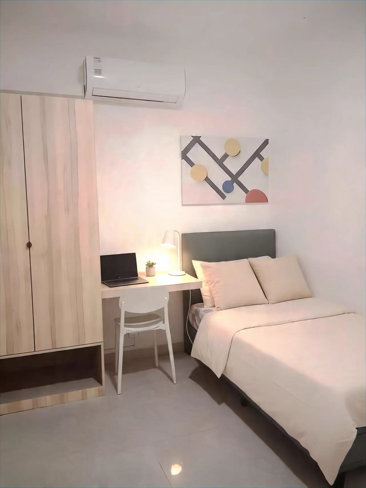 Furnished Singapore student room with bed, desk, storage and air-conditioning